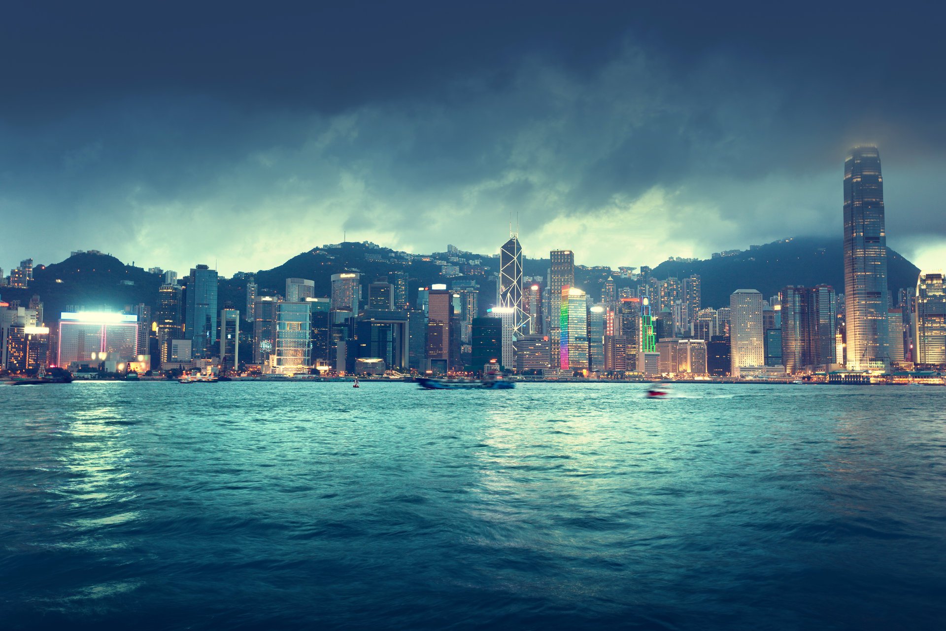 hong kong china city skyline sea river ships buildings sky clouds night lights town horizon beautiful landscape nice