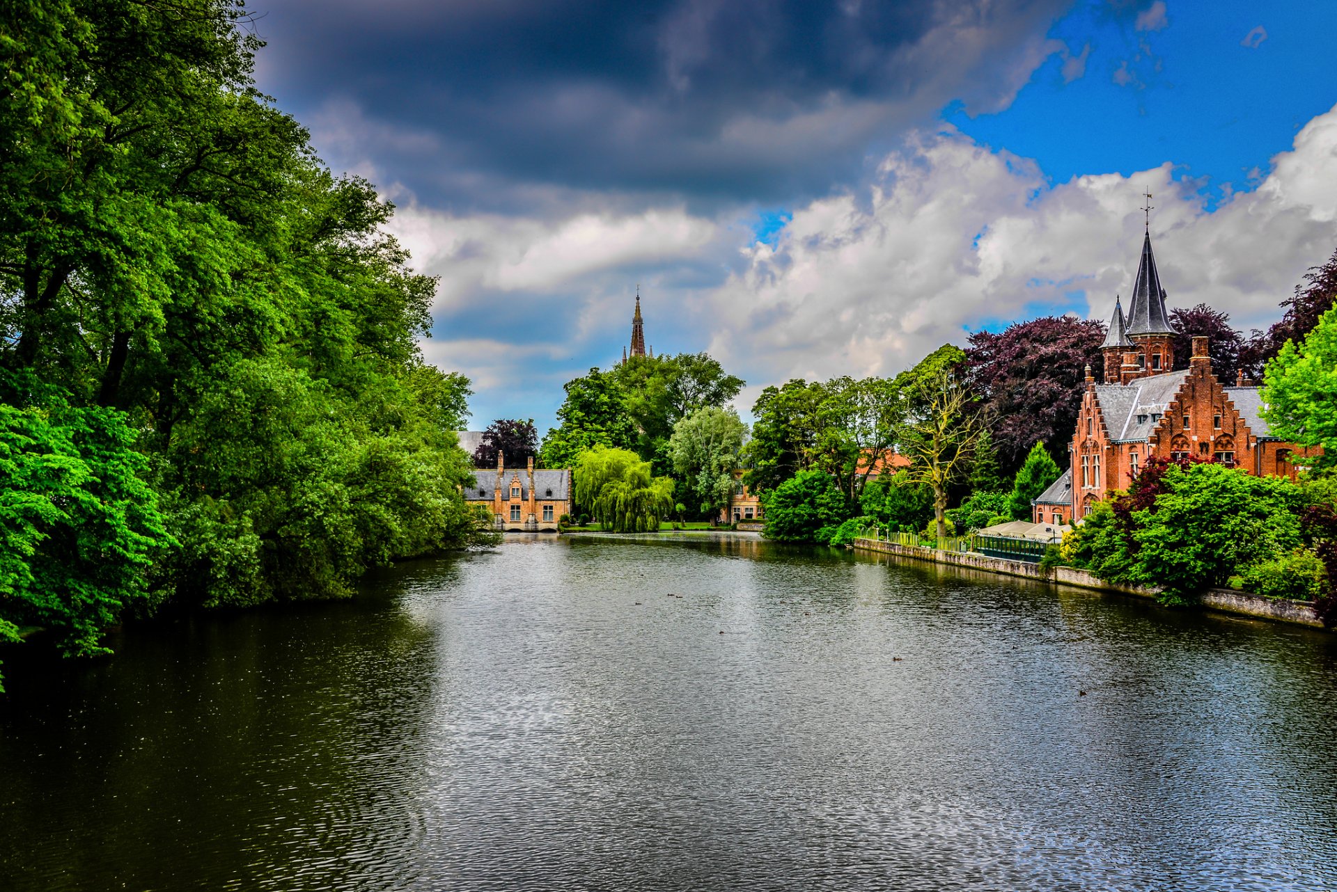 brugge belgium kasteel beauvigne minnewater park bruges town park river channel castle buildings architecture tree nature green sky clouds