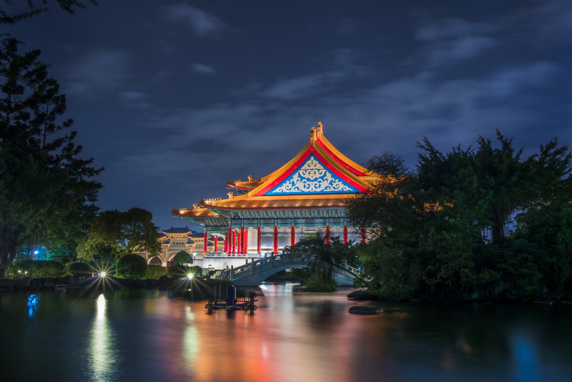 taiwan taipei national theatre building architecture supplies tree bridge pond night lighting blue sky clouds