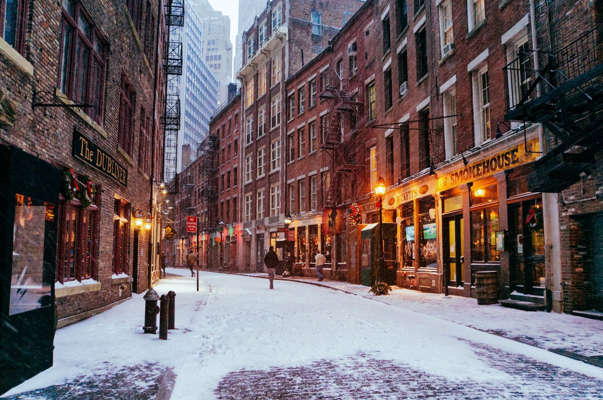 new york new york city manhattan financial district nyc usa united states town street road shops buildings house window people passers winter snow