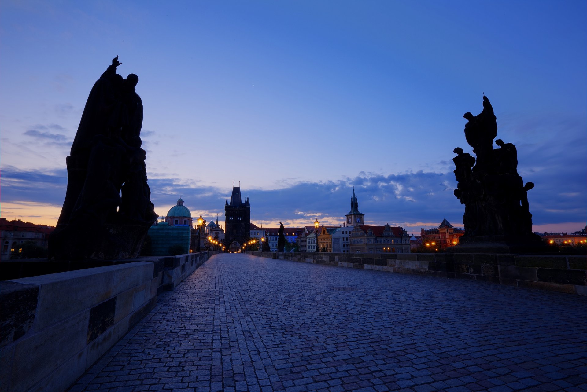 czech republic prague capital town charles bridge night twilight sunset sky clouds blue architecture light house buildings lights lamps