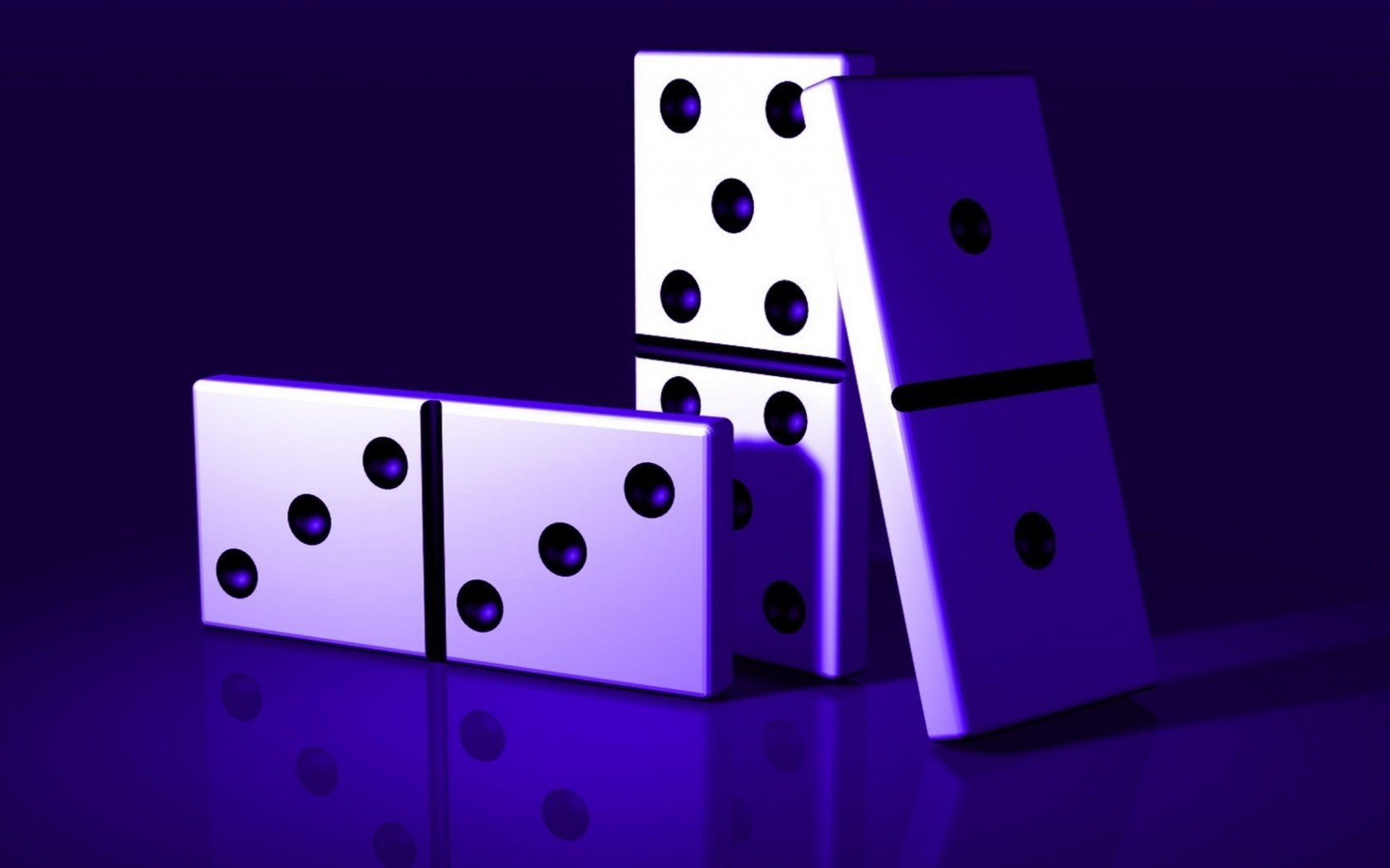 Photo of three dominoes on a blue background