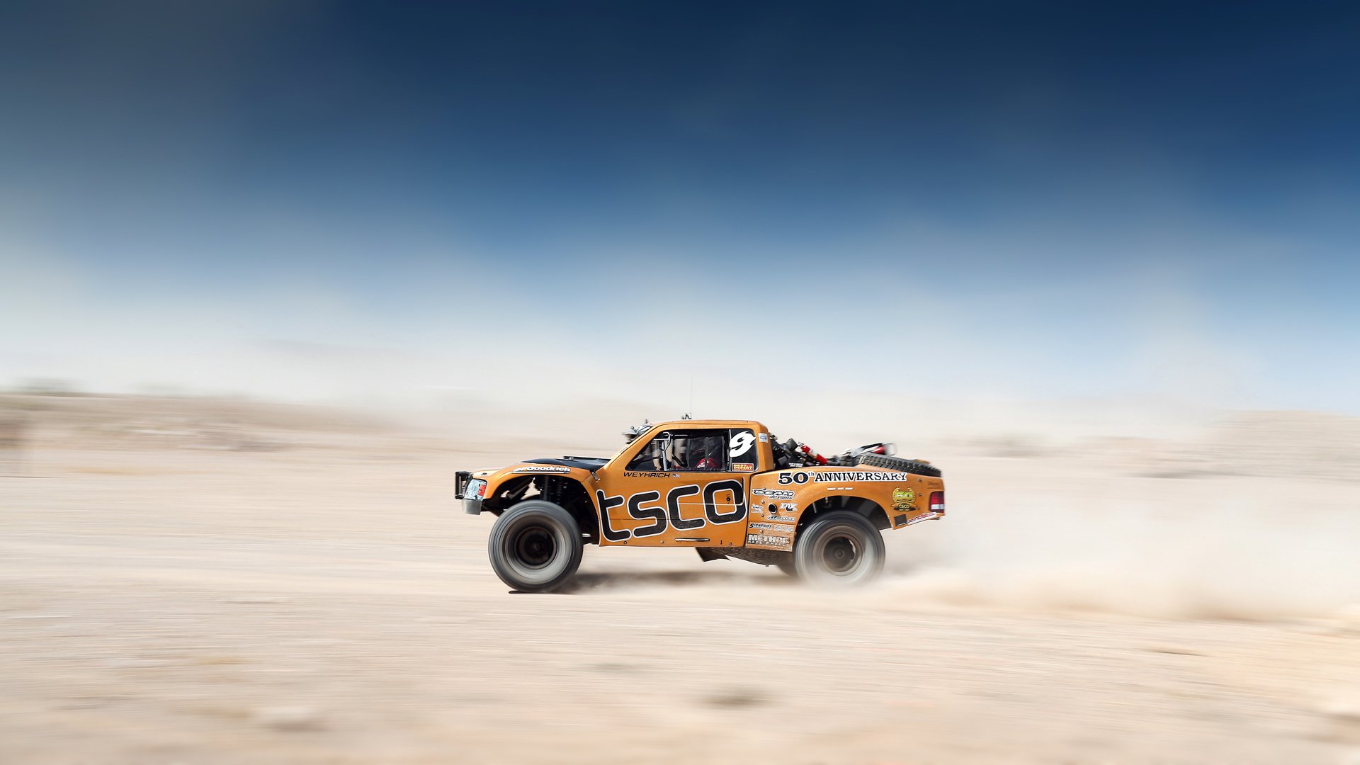 mint 400 desert race desert sky motion competition team car offroad blur orange