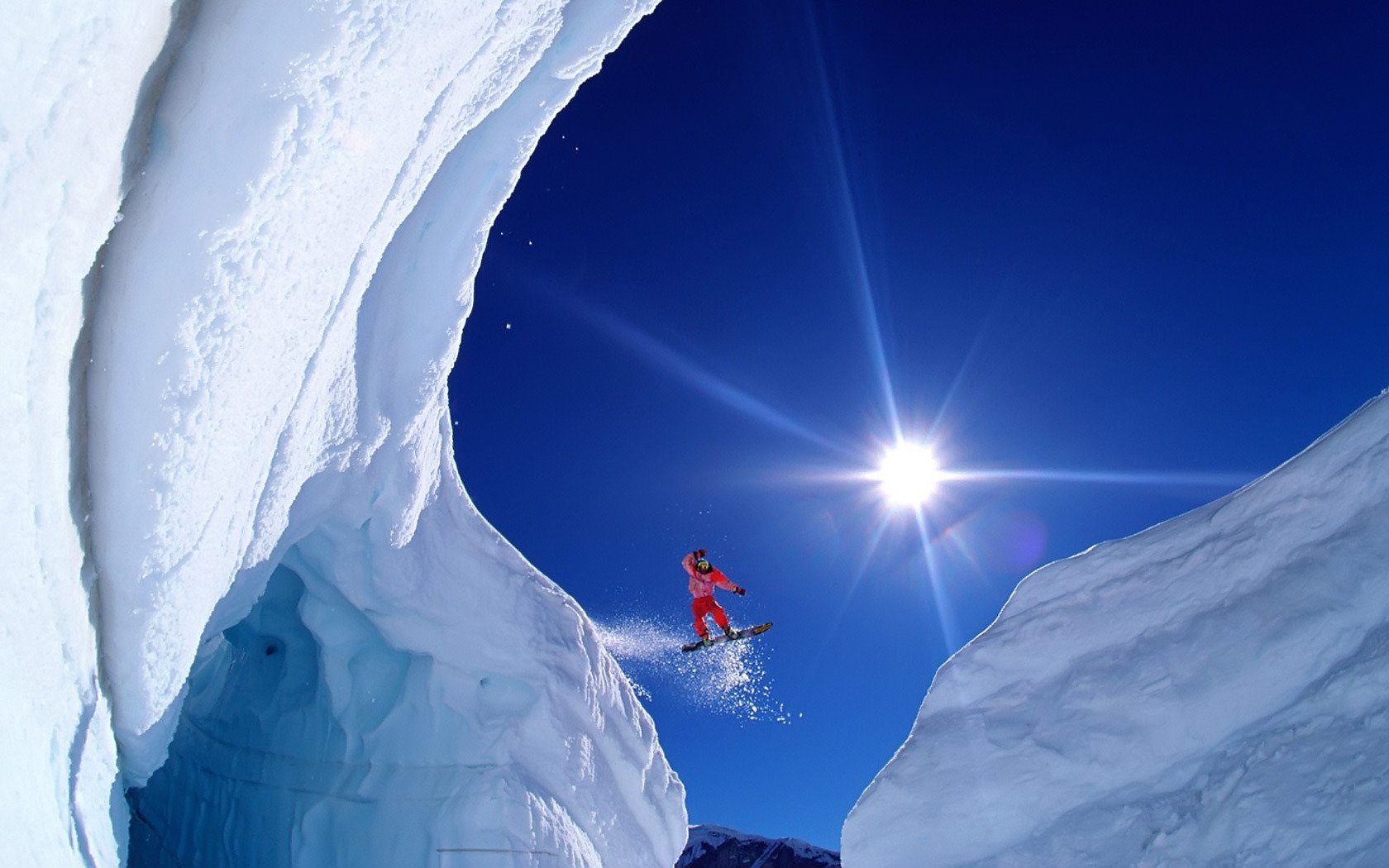 snowboarder snow mountain flight extreme sun