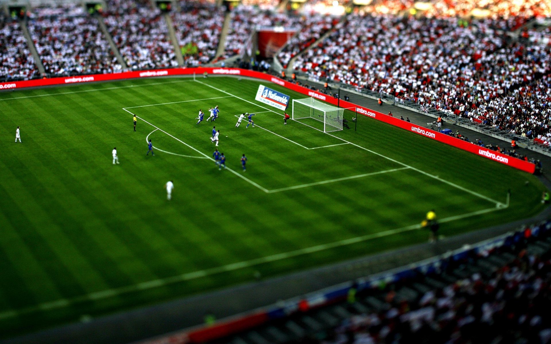 sports stadium grass game man soccer games people situation the situation balls gates blue white tilt-shift