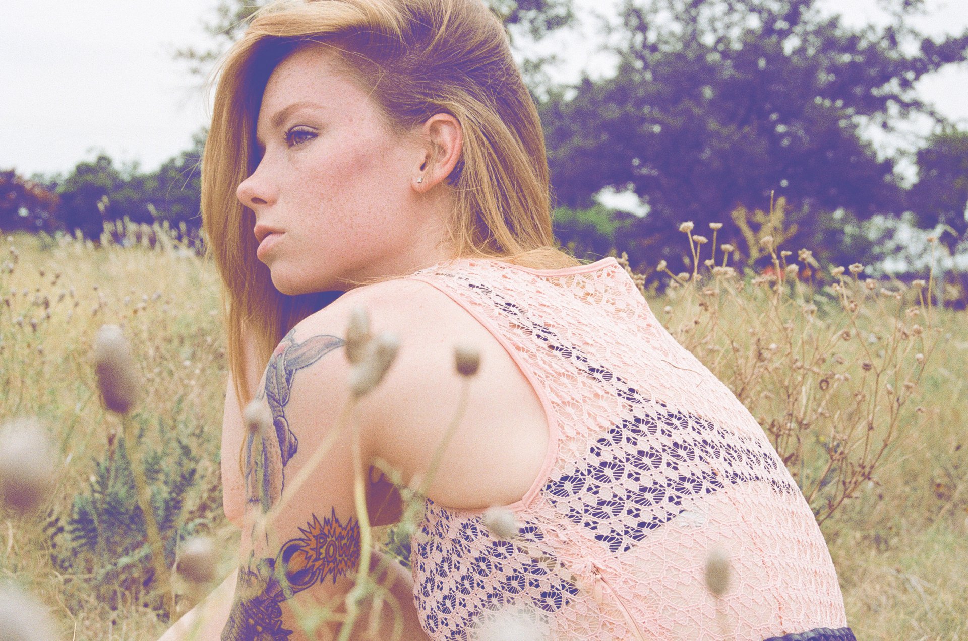 hattie watson female woman girl model back tats tattoos tattoo redhead field grass blouse bra