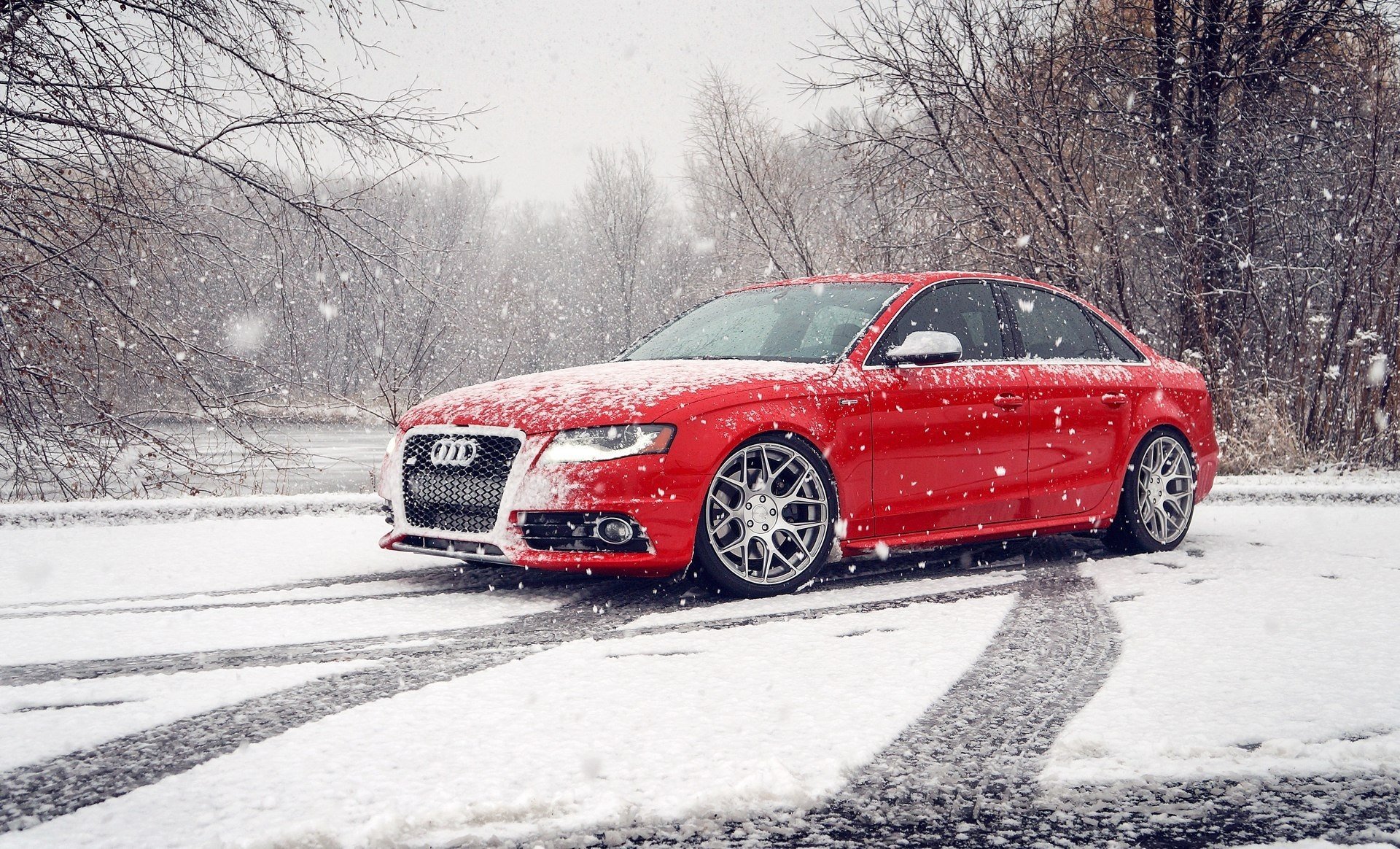 Red Audi outdoors in winter, in the snow