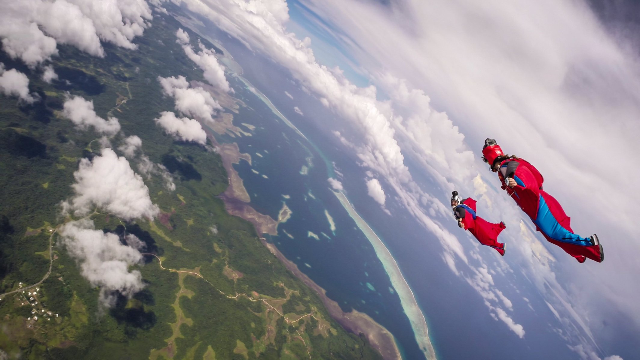 wingsuit drivers formation helmet camera clouds shadow sea island trailers parachute extreme sports