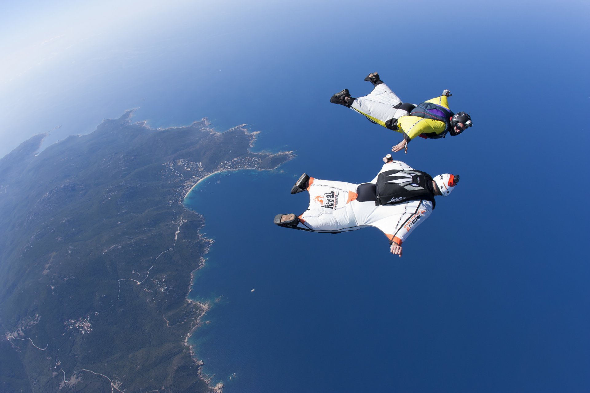 wingsuit drivers formation fs helmet camera sea sky sunny island trailers parachute extreme sports
