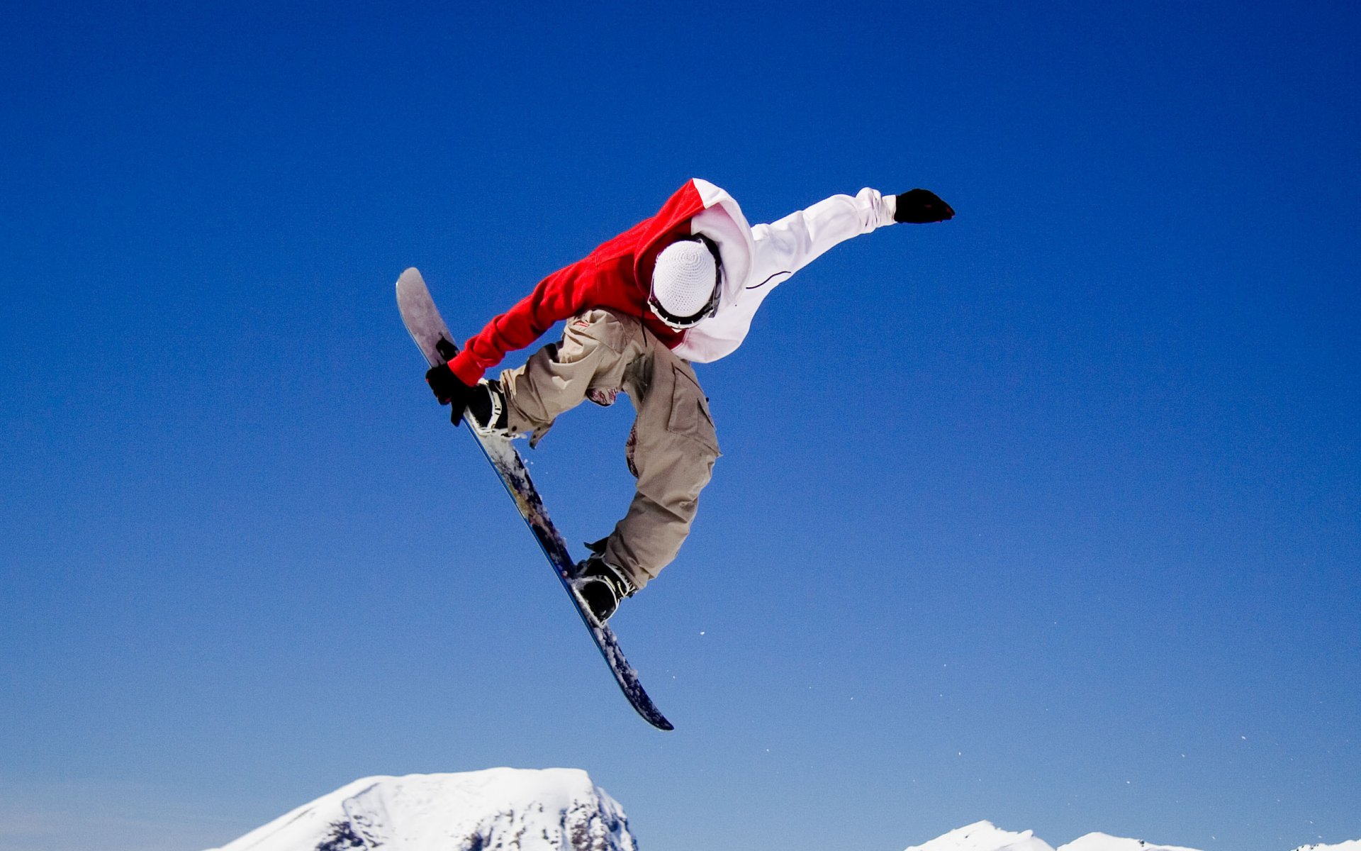 snowboarder jump flight stunt winter