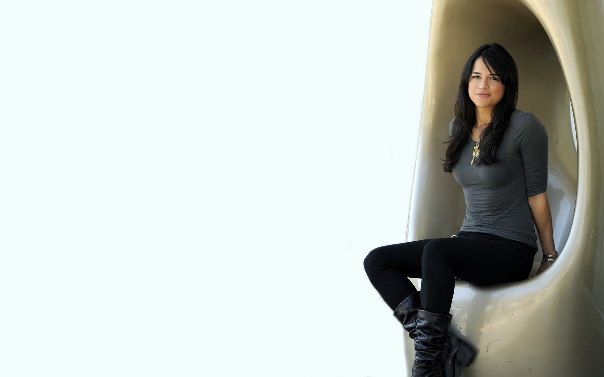 michelle rodriguez sitting boots jeans