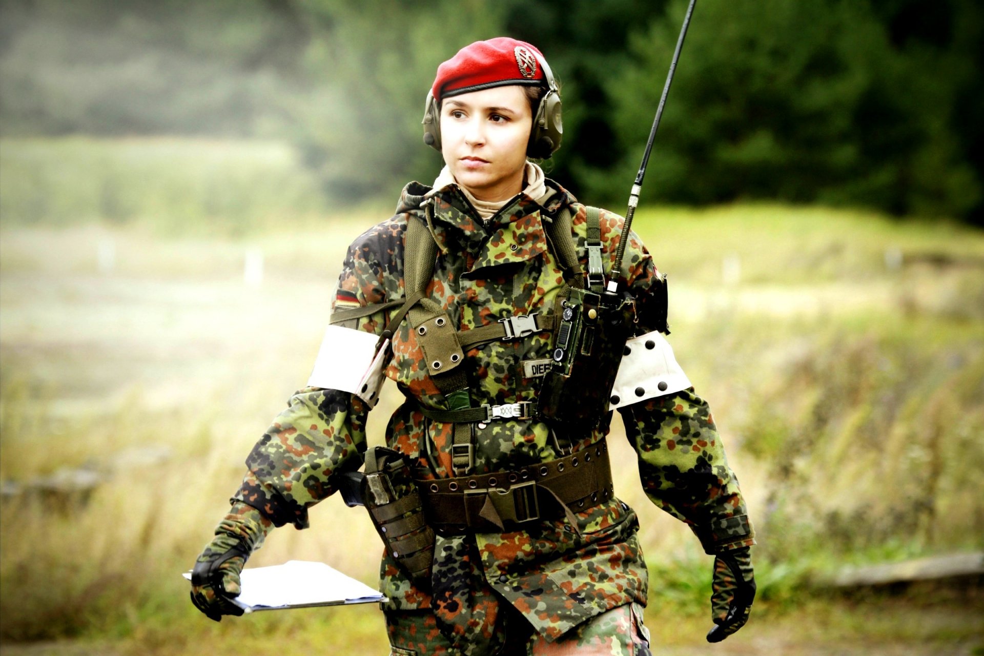 girl military uniforms industrial complex background blur