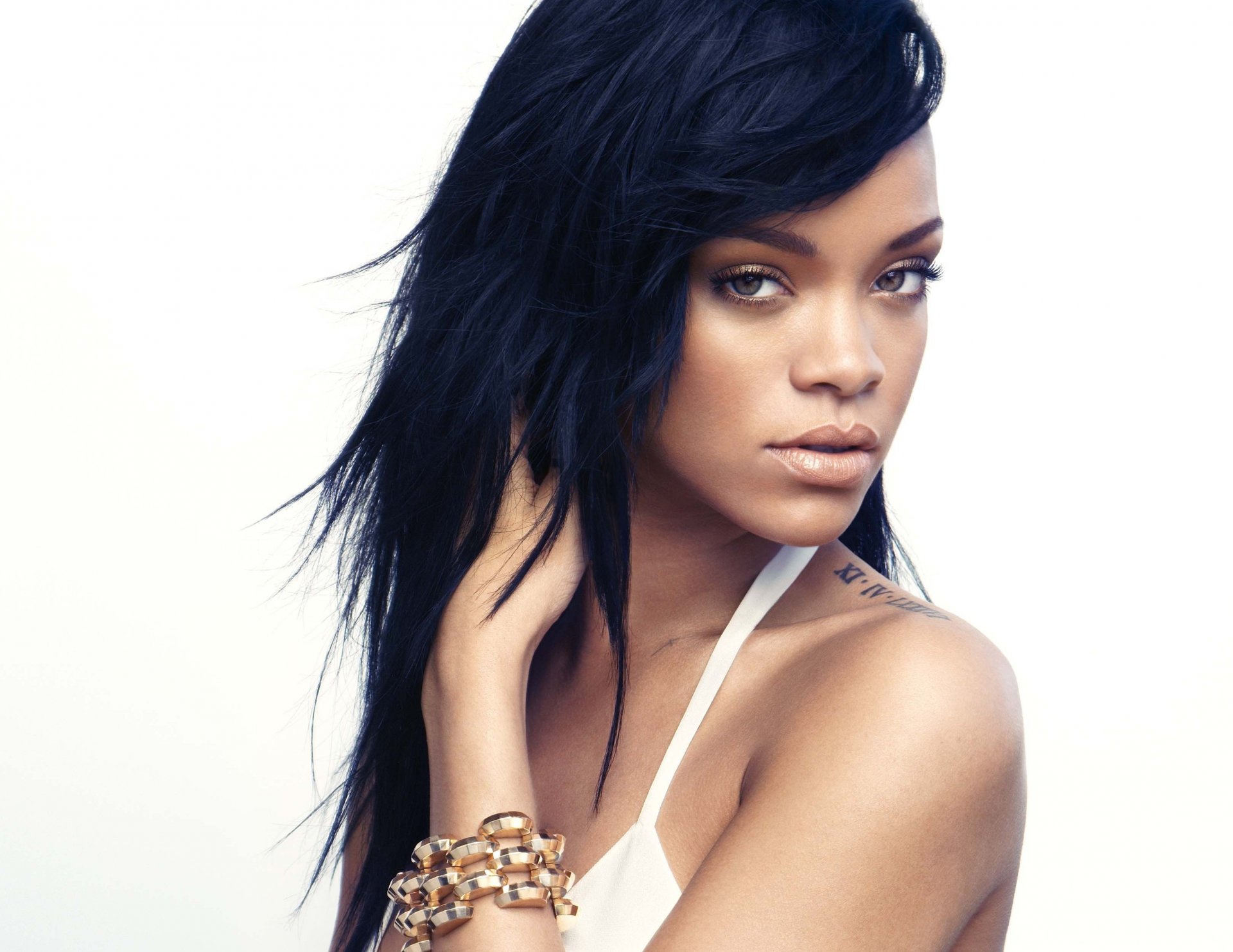 rihanna singer view face hair tattoos bracelet white background