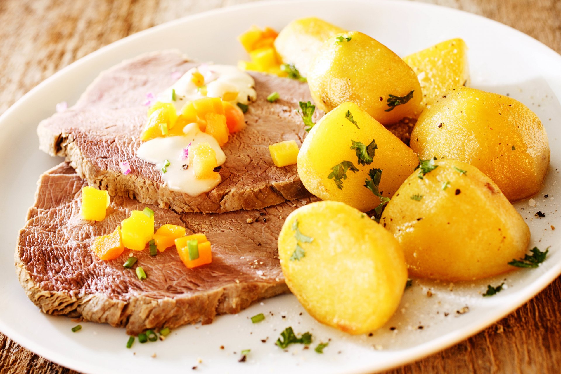food dish veal potatoes hot boiled oil carrots sauce green seasonings spices yum-yum background blur bokeh wallpaper.