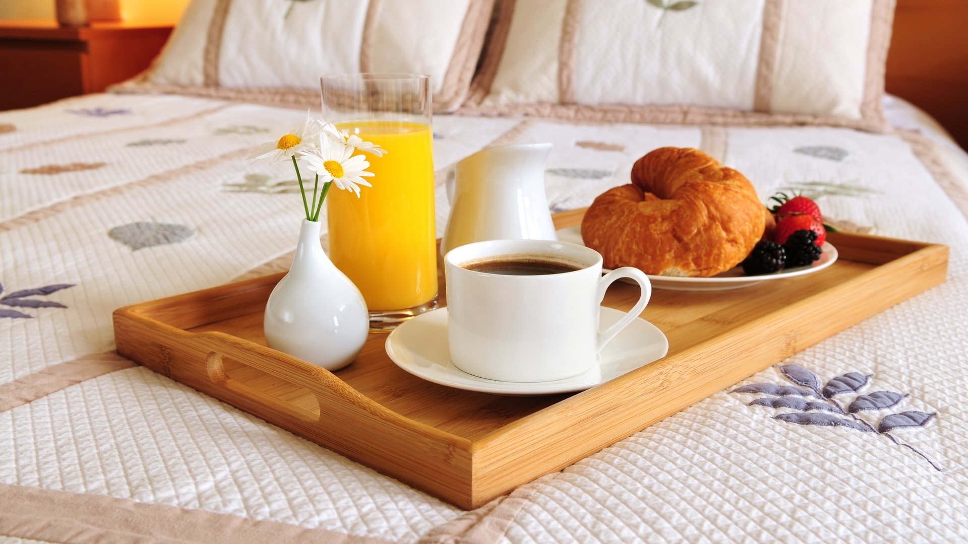 food breakfast bed coffee orange juice bagel croissant berries blackberry strawberry dish glass cup vase flower chamomile tray pillow coffe plates flowers camomiles