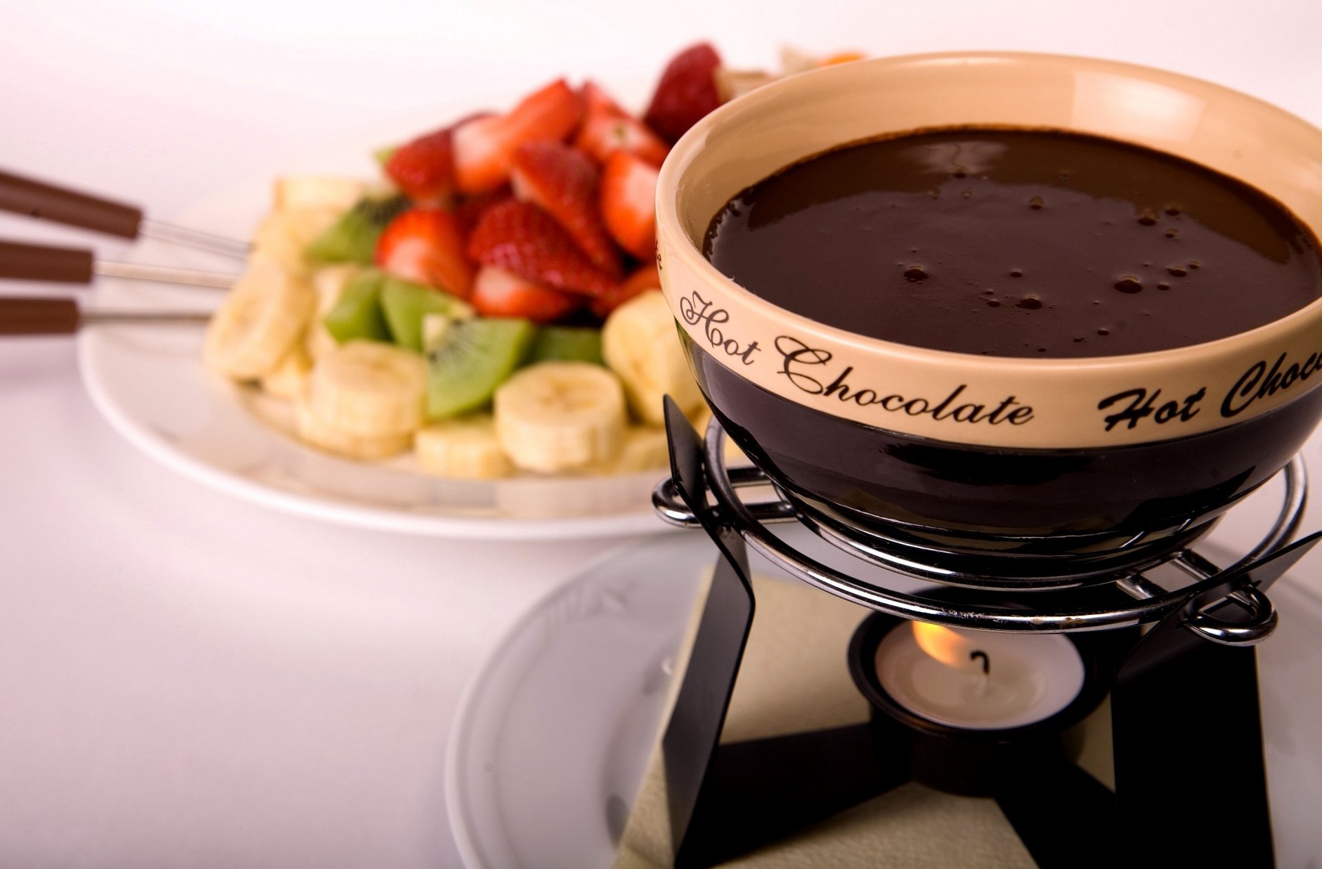 food drink delicious liquid hot chocolate fondue fruits bananas strawberry kiwi