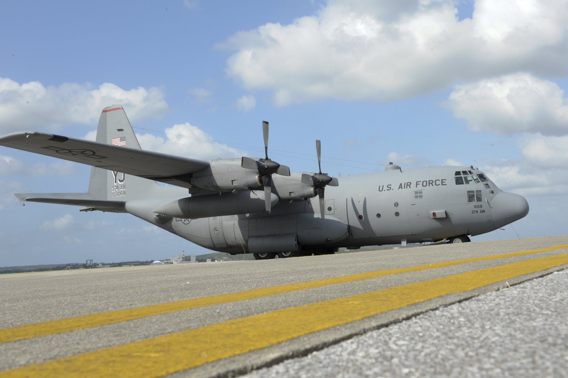 kadena afb lockheed c-130 hercules us air force military transport plane airport clouds