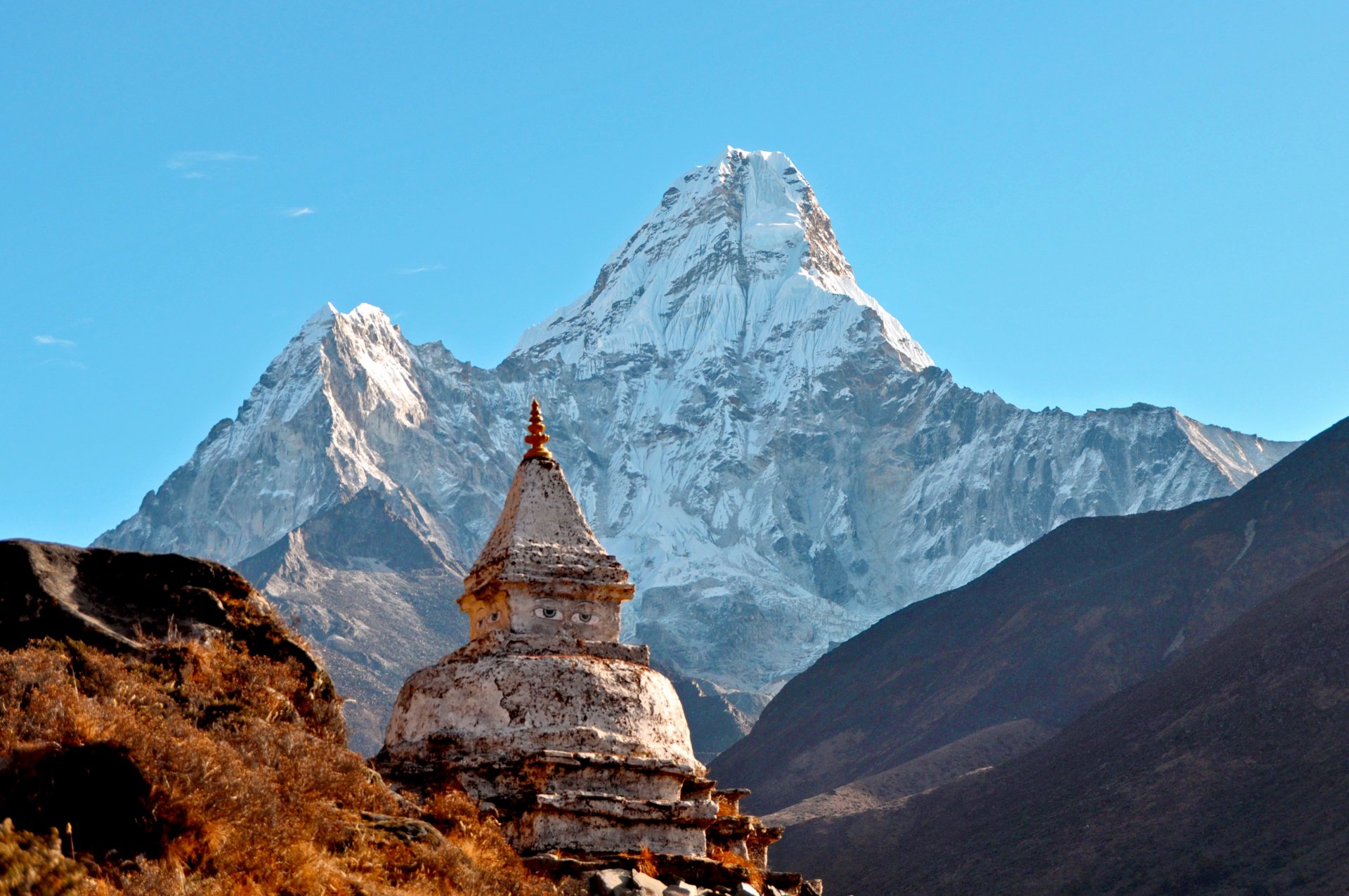 temple stone building drawn eyes blue sky lightweight cloud landscape mountain peak ama dablam ama dablam himalayas federal democratic republic nepal sanghiya loktāntrik ganatantra rock next white sno