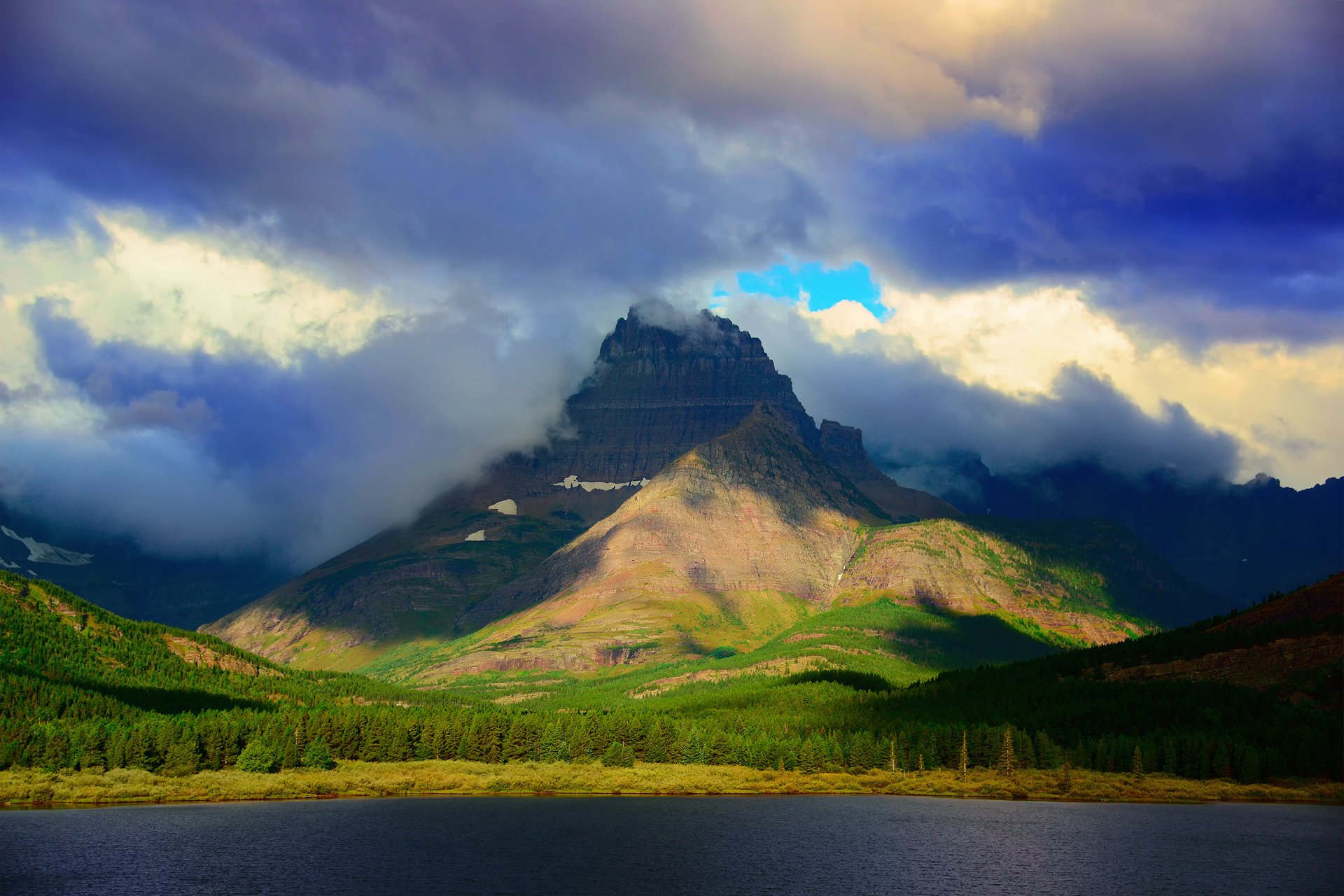 rocky mountains montana united states glacier national park mount wilbur mountain forest lake sky clouds