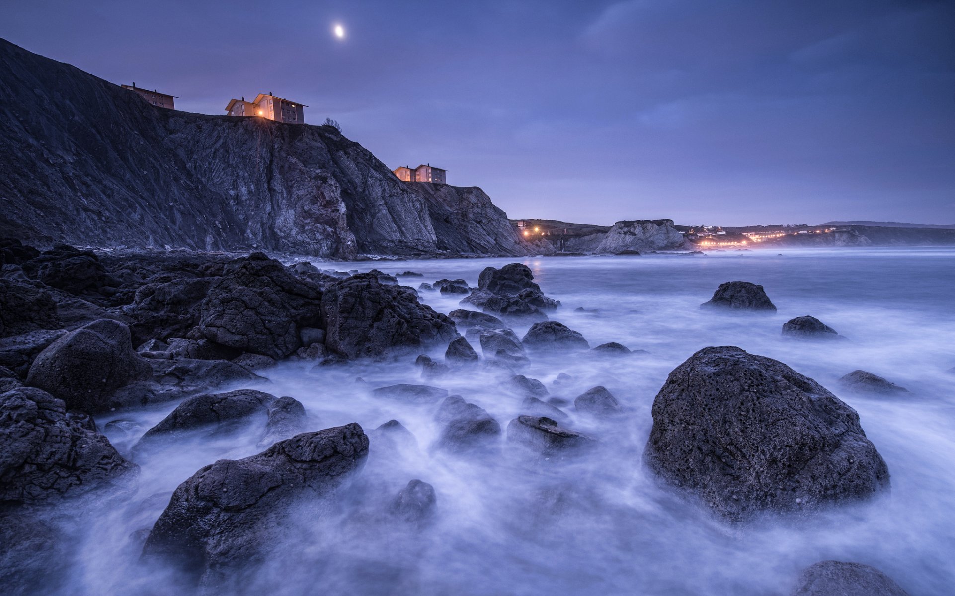 spain bay of biscay beach stones rock houses lights lighting night moon blue sky