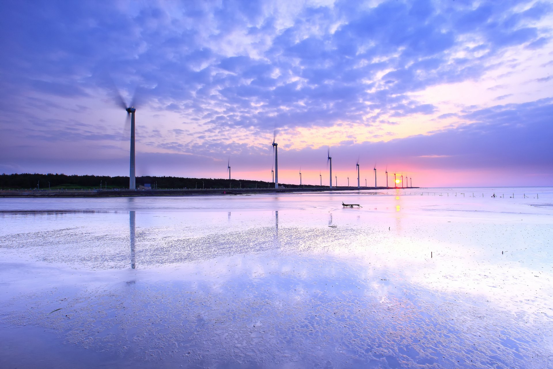 china taiwan beach stranded strait water reflection wind turbines windmills night sun pink sunset lilac sky clouds
