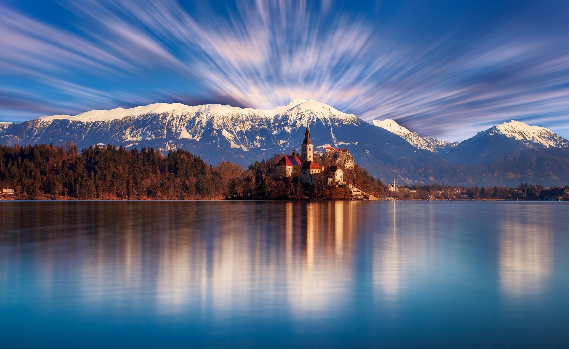 slovenia bled lake church temple forest tree beach mountain day sky clouds