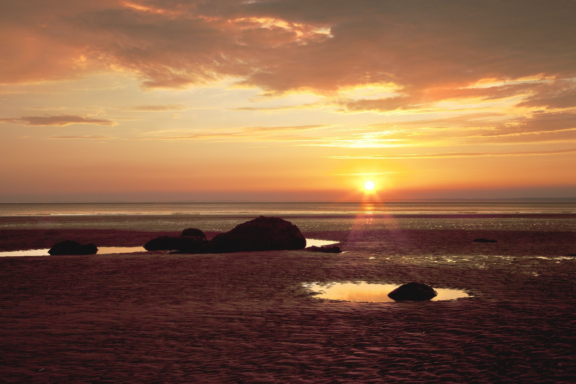 beach sea stones sunset