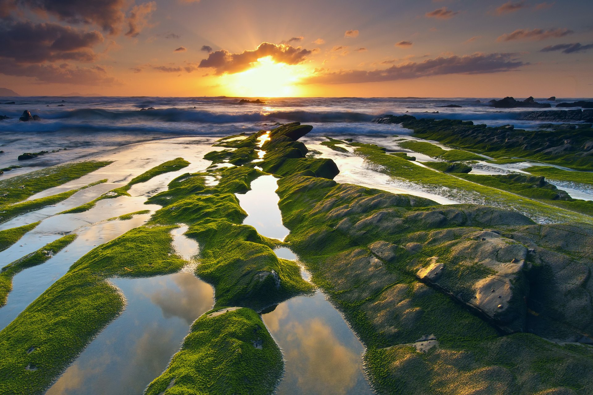 spain barrika sky sun light clouds sea rock stones moss extract waves water